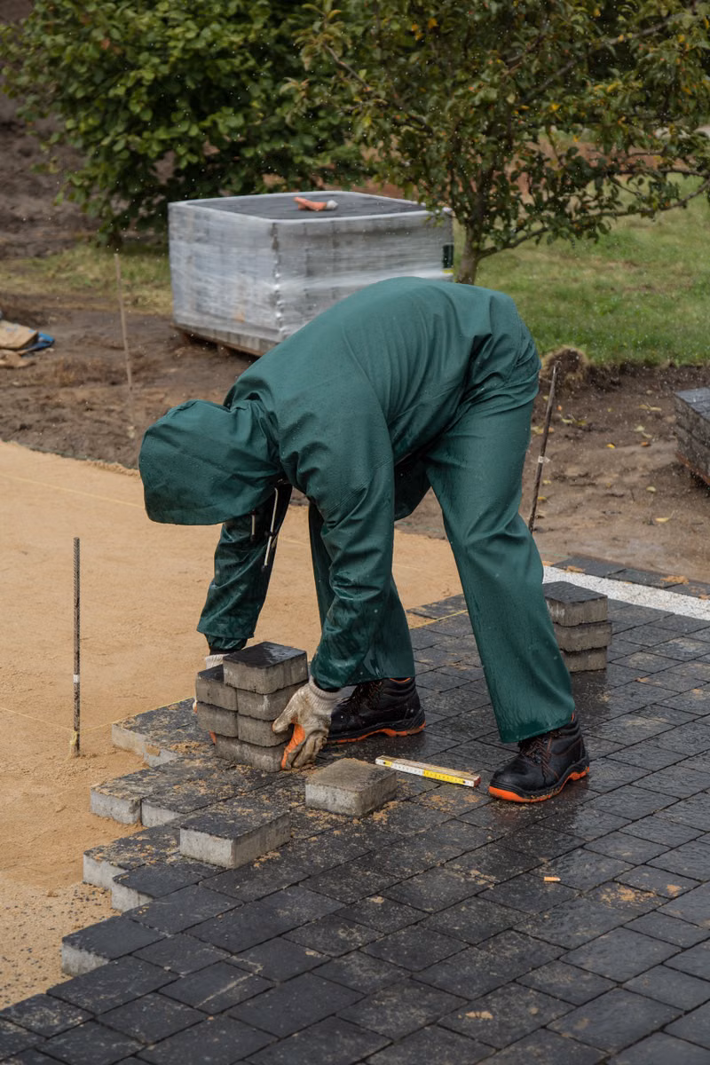 Lasting Imprssion Landscape crew installing a paver patio